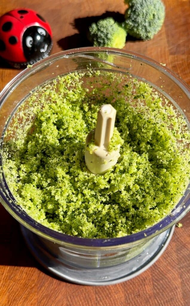 Grate fresh broccoli using a box grater or a food processor.