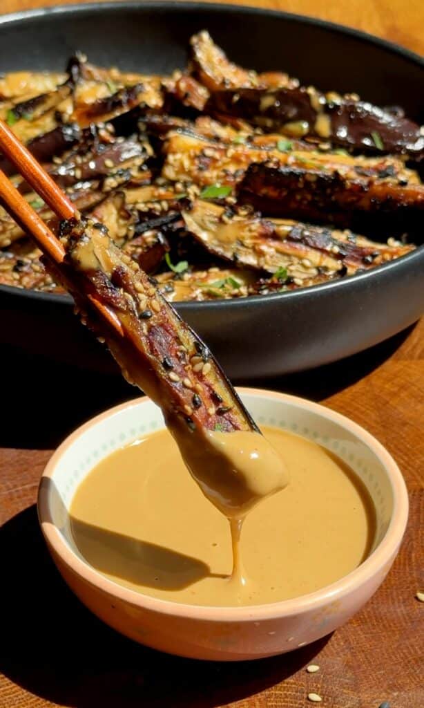 Crispy Miso-Parmesan Eggplant Sticks with creamy spicy peanut dipping sauce.
