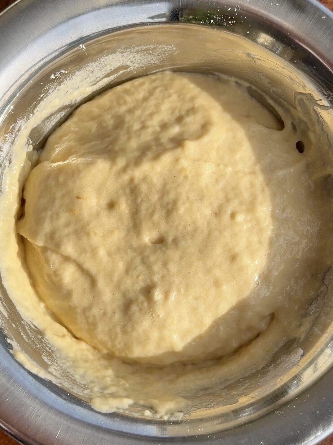 Fluffy apple ring batter in a bowl, ready for dipping apple slices.